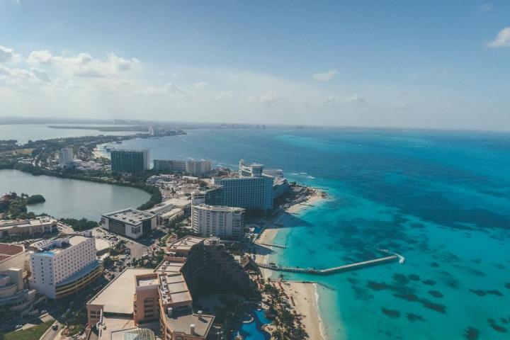 a large body of water with a city in the background